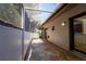 Private patio with covered screened lanai and tile flooring at 4802 Kestral Park Cir # 22, Sarasota, FL 34231