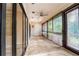 Sunroom with tile floors and plenty of natural light at 4802 Kestral Park Cir # 22, Sarasota, FL 34231