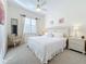 Spacious Primary bedroom with king-size bed and ensuite bathroom at 4867 Sabal Lake Cir, Sarasota, FL 34238