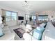 Bright and airy living room featuring ample natural light and comfortable seating at 4867 Sabal Lake Cir, Sarasota, FL 34238
