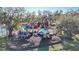Aerial view of a playground with play structures and shaded seating areas at 4867 Sabal Lake Cir, Sarasota, FL 34238