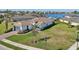 Aerial view of a single-Gathering home with a large yard and waterfront access at 5060 Lake Overlook Ave, Bradenton, FL 34208