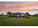 Spacious backyard with lush lawn and patio seating area at 5060 Lake Overlook Ave, Bradenton, FL 34208