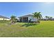 Large backyard with lush lawn and patio area at 5060 Lake Overlook Ave, Bradenton, FL 34208