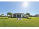Spacious backyard with patio and water view at 5060 Lake Overlook Ave, Bradenton, FL 34208