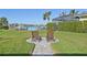 Landscaped backyard with patio and water view at 5060 Lake Overlook Ave, Bradenton, FL 34208