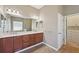 Double vanity bathroom with a walk-in closet at 5060 Lake Overlook Ave, Bradenton, FL 34208