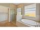 Bathroom with a shower, garden tub and walk-in closet at 5060 Lake Overlook Ave, Bradenton, FL 34208