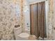 Bathroom with patterned wallpaper and a shower/tub combo at 5060 Lake Overlook Ave, Bradenton, FL 34208
