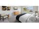 Main bedroom with a king bed and water view at 5060 Lake Overlook Ave, Bradenton, FL 34208