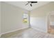 Spacious bedroom with wood-look floors and ceiling fan at 5060 Lake Overlook Ave, Bradenton, FL 34208
