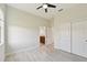 Light and airy bedroom with wood-look floors and ceiling fan at 5060 Lake Overlook Ave, Bradenton, FL 34208