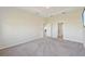 Bright bedroom with grey carpet and access to bathroom at 5060 Lake Overlook Ave, Bradenton, FL 34208