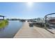 Long wooden dock with many boats at 5060 Lake Overlook Ave, Bradenton, FL 34208