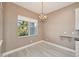 Light brown dining room with hardwood floors and a chandelier at 5060 Lake Overlook Ave, Bradenton, FL 34208