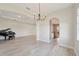 Elegant dining room with hardwood floors and a chandelier, offering views of the kitchen at 5060 Lake Overlook Ave, Bradenton, FL 34208