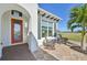 Front porch with rocking chairs and a stone patio at 5060 Lake Overlook Ave, Bradenton, FL 34208