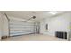 Attached garage with overhead door and ample space at 5060 Lake Overlook Ave, Bradenton, FL 34208