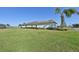 House side view, showcasing a well-maintained lawn and landscaping at 5060 Lake Overlook Ave, Bradenton, FL 34208