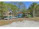 Community kayak racks with various kayaks at 5060 Lake Overlook Ave, Bradenton, FL 34208