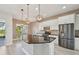 Modern kitchen with stainless steel appliances and a large island at 5060 Lake Overlook Ave, Bradenton, FL 34208