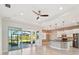 Open kitchen with island, stainless steel appliances, and views to backyard at 5060 Lake Overlook Ave, Bradenton, FL 34208