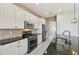 Modern kitchen with stainless steel appliances and granite countertops at 5060 Lake Overlook Ave, Bradenton, FL 34208