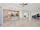 Modern kitchen with white cabinets, island, and pendant lighting at 5060 Lake Overlook Ave, Bradenton, FL 34208