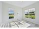 Bright office with large windows and wood-look tile floors at 5060 Lake Overlook Ave, Bradenton, FL 34208