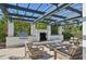 Outdoor kitchen with grill and fireplace at 5060 Lake Overlook Ave, Bradenton, FL 34208