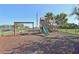 Community playground with swings and playset at 5060 Lake Overlook Ave, Bradenton, FL 34208