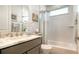 Clean bathroom with a single vanity, marble countertop, and a bathtub at 5252 Willow Lake Ct, Sarasota, FL 34233