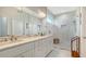 Elegant bathroom with double vanity, marble countertops, and a large walk-in shower at 5252 Willow Lake Ct, Sarasota, FL 34233