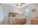Charming bedroom featuring a wooden bed frame and tropical bedding at 5252 Willow Lake Ct, Sarasota, FL 34233