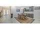 Round dining table with gray cabinets and a marble countertop at 5252 Willow Lake Ct, Sarasota, FL 34233