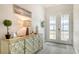 Entryway with console table, decorative lamps, and access to other rooms at 5252 Willow Lake Ct, Sarasota, FL 34233