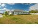 Single-story home with landscaping and driveway at 5252 Willow Lake Ct, Sarasota, FL 34233