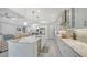 Modern kitchen with a large island, white cabinetry, and marble countertops at 5252 Willow Lake Ct, Sarasota, FL 34233