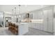 Spacious kitchen with white cabinets, marble countertops, and stainless steel appliances at 5252 Willow Lake Ct, Sarasota, FL 34233