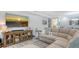Living room with sectional sofa, large TV, and decorative accessories at 5252 Willow Lake Ct, Sarasota, FL 34233
