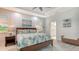 Main bedroom with a king-size bed and access to the bathroom at 5252 Willow Lake Ct, Sarasota, FL 34233