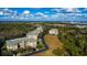 Aerial view of community with buildings, landscaping and open space at 5306 Manorwood Dr # 2A, Sarasota, FL 34235