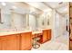 Elegant bathroom with double vanity, large mirror, and plenty of storage at 5306 Manorwood Dr # 2A, Sarasota, FL 34235