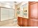 Bathroom with tub shower combo, single vanity, and linen storage at 5306 Manorwood Dr # 2A, Sarasota, FL 34235