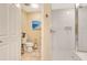 Bathroom with toilet, shower, and white tile at 5306 Manorwood Dr # 2A, Sarasota, FL 34235