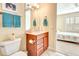 Well-appointed bathroom with single vanity and a view into bedroom at 5306 Manorwood Dr # 2A, Sarasota, FL 34235