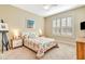 Spacious bedroom with a comfortable bed and large window with plantation shutters at 5306 Manorwood Dr # 2A, Sarasota, FL 34235