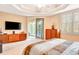 Spacious bedroom with large sliding glass doors leading to a balcony at 5306 Manorwood Dr # 2A, Sarasota, FL 34235