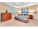 Bright bedroom featuring a king-size bed and large artwork at 5306 Manorwood Dr # 2A, Sarasota, FL 34235