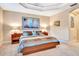Spacious bedroom with large bed and artwork at 5306 Manorwood Dr # 2A, Sarasota, FL 34235